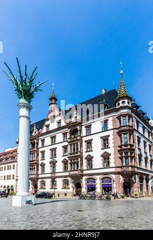 view in Leipzig to old Nicolai place with old houses and Nicolai pillar Stock Photo