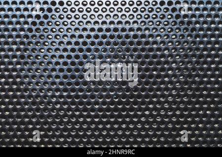 Grid pattern surface. dusty speaker mesh texture close up. perforated plastic. abstract background Stock Photo