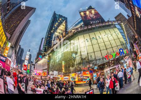 people visit Times Square, featured with Broadway Theaters and huge number of LED signs Stock Photo