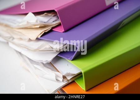 File Folder Binder stack of multi color on table in office. Stock Photo