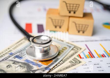 Shopping cart logo on box with US dollar banknotes on graph background. Banking Account, Investment Analytic research data economy, trading, Business Stock Photo