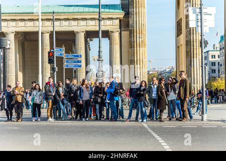 people visit the Brandenburg Gate (Brandenburger Tor) in Berli Stock Photo