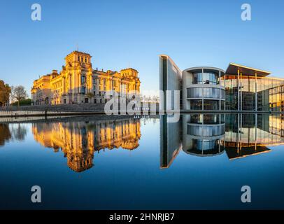 Reichstag with reflection in Spree, Berlin Stock Photo