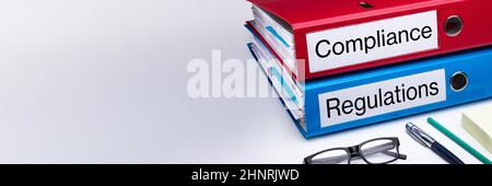 Compliance And Regulation With Office Supplies Over Business Desk Stock Photo