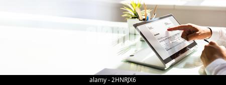Online Digital E Invoice Statement On Hybrid Laptop Stock Photo