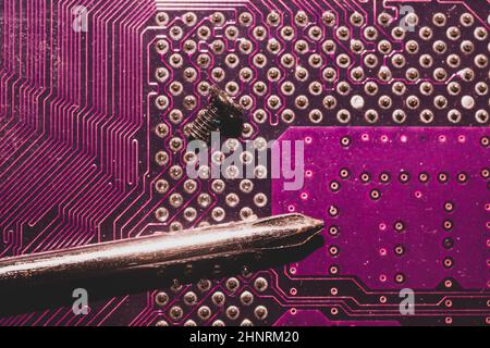 Processor pins macro. computer motherboard close up. cpu pins on a circuit board. micro elements of computer central processor unit. modern technologi Stock Photo