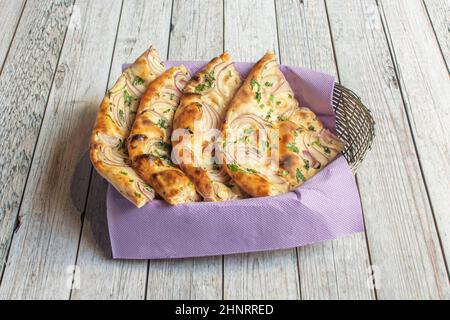 Naan is a flat bread, made from wheat flour and usually leavened. It is commonly consumed in several regions of Central Asia and South Asia: Afghanist Stock Photo