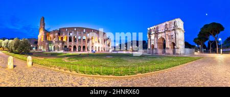 Colosseum and Arch of Constantine square panoramic dawn view in Rome Stock Photo