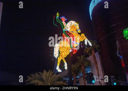 The colorful neon horse and rider sign from the former Hacienda Hotel greets visitors to the Fremont Street Experience in Las Vegas, Nevada Stock Photo