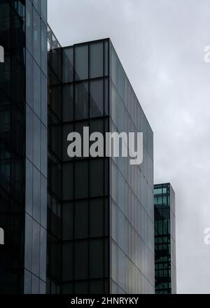 London, United Kingdom - October 22, 2006: Rectangle windows on glass and steel offices ("More London Estates" design by Foster and Partners) overcast sky in background. Stock Photo