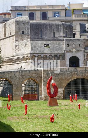 Castello Normanno Svevo Castle of Bari and art installation with red chili peppers Stock Photo