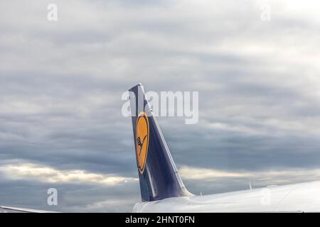 Lufthansa aircraft at airport Frankfurt under dark clouds Stock Photo