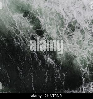 Big water splash seen from above a boat Stock Photo