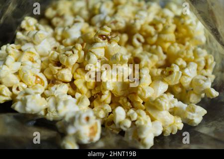 Popcorn in a plastic bag as a background. Stock Photo