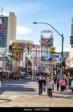 people crossing the 6th street in the old part of Las Vegas at Fremont street with the old typical neon signs Stock Photo