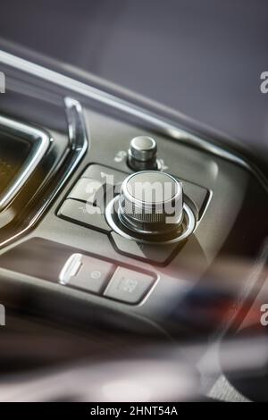 Close up shot of modern central console with buttons on car panel. Stock Photo