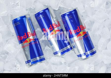 Red Bull Energy Drink lemonade soft drinks in cans on ice cubes Stock Photo