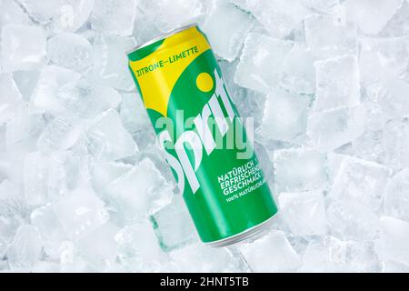 Sprite lemonade soft drink in a can on ice cubes Stock Photo