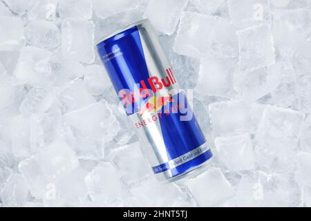 Red Bull Energy Drink lemonade soft drink in can on ice cubes Stock Photo