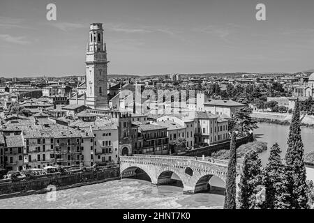 panorama of Verona with view of the old dome and the roman bridge, spanning river Etsch under blue sky Stock Photo