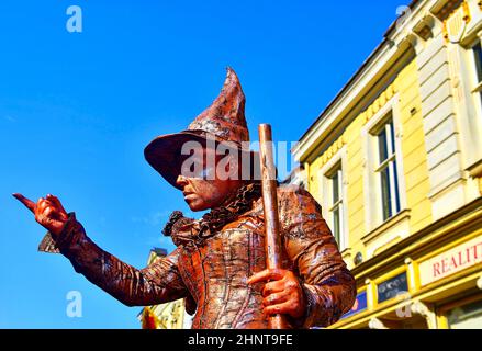 Living statue of witch. Live statue of sorceress. Stock Photo