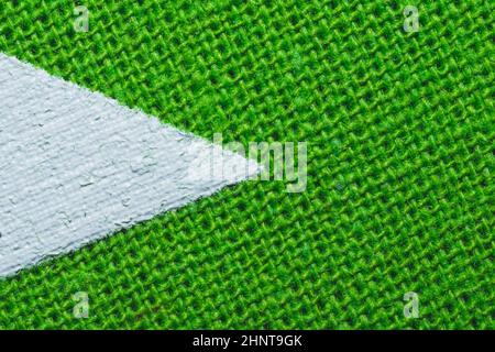 Green fabric texture with white painted place. knitted textile close up. woven background with copy space Stock Photo