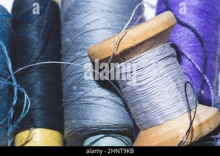 Tangled threads for sewing. different spools of thread Stock Photo