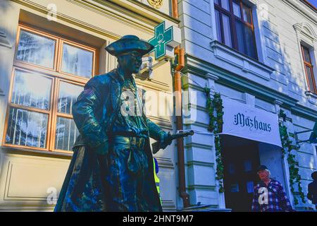 Cupreous painted artist like living statue dressed like pirate. Living statue of corsair. Living statue street performer. Living statue performers can fool passersby and entertain tourists. Stock Photo