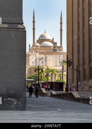 Great Mosque of Muhammad Ali Pasha, framed by Al Rifai Mosque and Sultan Hassan Mosque, Citadel of Cairo in Egypt Stock Photo