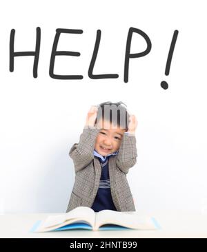 Stressed  kid need help during the study Stock Photo