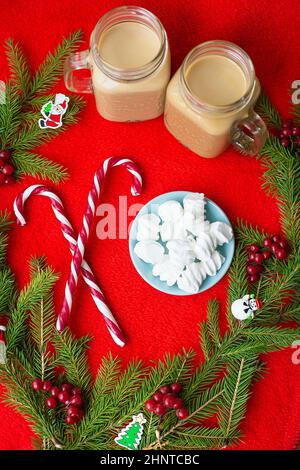 Christmas tree, candy, coffee marshmellou on a red background. Happy New Year. Stock Photo