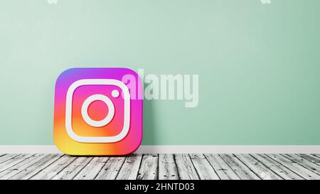 Instagram Logo on Wooden Floor Against Wall Stock Photo