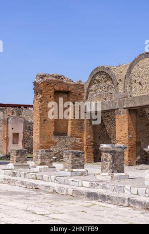 Ruins of an ancient city destroyed by the eruption of the volcano Vesuvius in 79 AD near Naples, Pompeii, Italy. Portico in front of the entrance to the Macellum Stock Photo