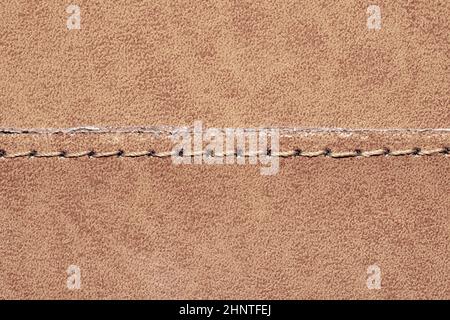 Brown leather texture with a linear stitch. material with seam Stock Photo