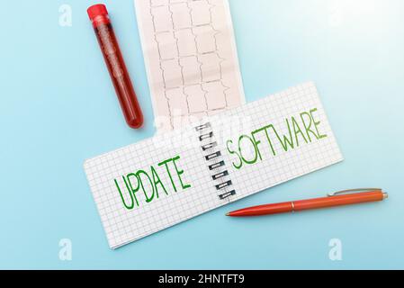 Writing displaying text Update Software. Word for replacing program with a newer version of same product Reading Graph And Writing Important Medical Notes Test Result Analysis Stock Photo