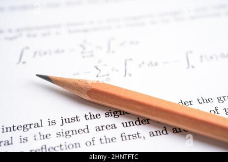 Pencil on mathematic formula exercise test paper in education school. Stock Photo