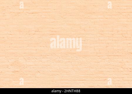 harmonic old brick wall painted in ocre as background Stock Photo