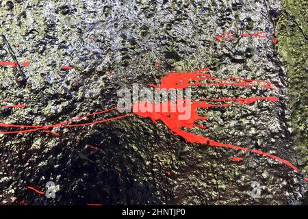 Colorful graffiti paint splashes on the wall and ground at a lost place ruin in Kiel northern germany Stock Photo