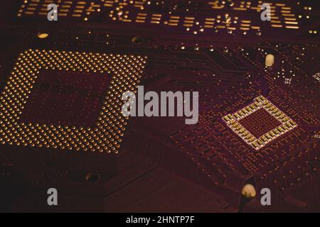 Processor pins macro. computer motherboard close up. cpu pins on a circuit board. micro elements of computer central processor unit. modern technologi Stock Photo