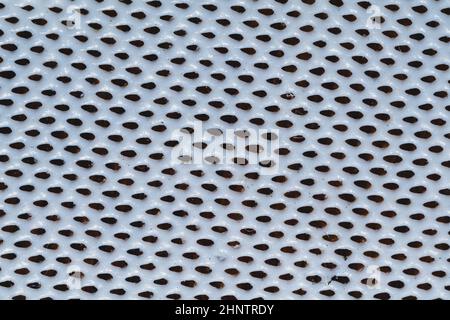 Rubber surface with uneven holes. white plastic texture with dots. abstract background Stock Photo