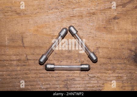 Fuse on wooden background. safety device for overcurrent protection. protection of an electrical circuit Stock Photo