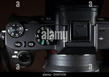 Shutter Speed dial of a digital camera in black background. Stock Photo