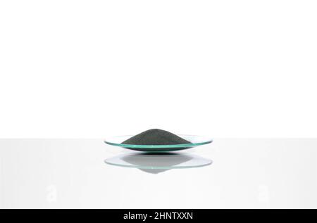 Zinc Powder in Chemical Watch Glass. Close up chemical ingredient on white laboratory table. Side View Stock Photo
