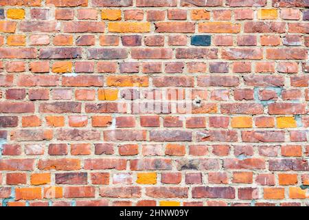 old brick wall in red gives a harmonic pattern Stock Photo