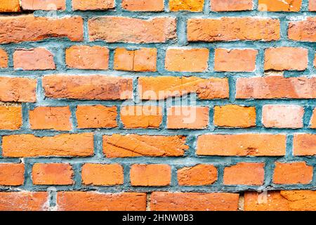old brick wall in red gives a harmonic pattern Stock Photo
