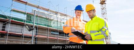 Construct Site Engineer Pointing. Worker Inspector With Clipboard Stock Photo