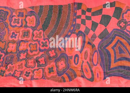 detail of hand painted handcrafted red silk scarf in cold contour technique Stock Photo