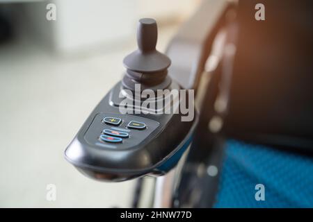 Electric wheelchair for old elder patient cannot walk or disable people use in home or hospital, healthy strong medical concept. Stock Photo
