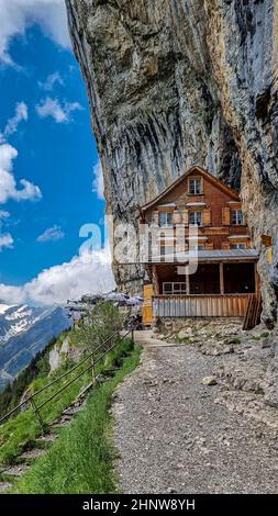 Vertical shot of Ebenalp with its famous cliff inn Aescher, Switzerland Stock Photo