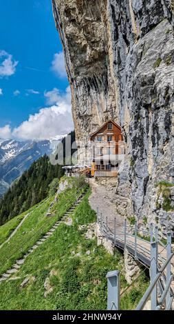 Vertical shot of Ebenalp with its famous cliff inn Aescher, Switzerland Stock Photo